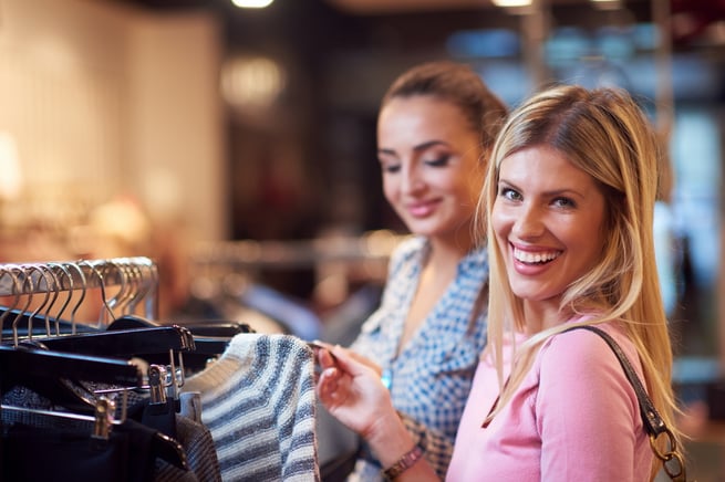 happy young girls in shopping mall, friends having fun together
